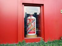 A giant bottle of liquor is being displayed in the window of a Kweichow Moutai store in Shanghai, China, on June 3, 2023. (