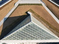 An aerial photo is showing a pyramid-shaped building that is the future community neighborhood center in Hangzhou, Zhejiang Province, China,...