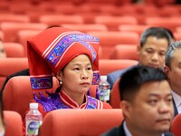 Representatives of ethnic minorities are wearing national costumes at the fifth session of the 15th People's Congress in Liuzhou, China, on...