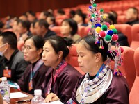 Representatives of ethnic minorities are wearing national costumes at the fifth session of the 15th People's Congress in Liuzhou, China, on...