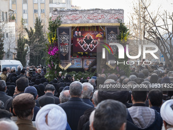 A truck is carrying the coffins containing the bodies of the Head of the Islamic Revolutionary Guard Corps' (IRGC) Quds Force Intelligence U...