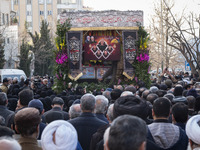A truck is carrying the coffins containing the bodies of the Head of the Islamic Revolutionary Guard Corps' (IRGC) Quds Force Intelligence U...