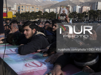 Iranian mourners are mourning over a coffin containing the body of an Islamic Revolutionary Guard Corps' (IRGC) Quds Force military personne...