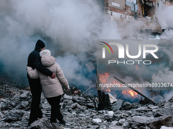 People are standing near the site of the missile strike, in Kharkiv, Ukraine, on January 23, 2024. On The Morning Of January 23, 2024, Russi...