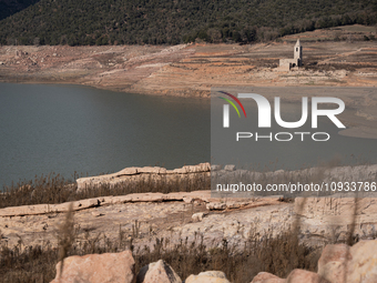 The Sau reservoir is seen at its historical minimum with the church of the old town of Sant Roma de Sau exposed in Osona, Spain, on January...