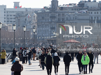 Tourists are visiting the Bund scenic area in Shanghai, China, on January 23, 2024. (