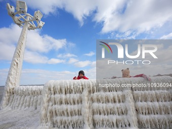 Tourists are viewing the ice landscape at the seaside in Yantai, China, on January 24, 2024. (