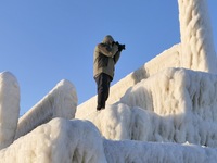 Tourists are viewing the ice landscape at the seaside in Yantai, China, on January 24, 2024. (