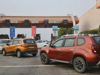Vehicles are lining up at a toll booth along the Yamuna Expressway in Greater Noida, Uttar Pradesh, India, on May 3, 2022. (