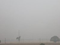 Thick smog is covering farmland in Greater Noida, Uttar Pradesh, India, on May 3, 2022. (