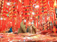 People are shopping for Spring Festival ornaments at a shopping mall in Nanjing, China, on January 27, 2024. (