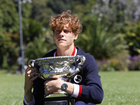 Jannik Sinner of Italy is posing with the Norman Brookes Challenge Cup after winning the 2024 Australian Open Final at the Royal Botanic Gar...