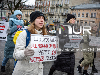 Participants are picketing in Lviv, Ukraine, on January 28, 2024, as military relatives demand the demobilization of soldiers after 18 month...