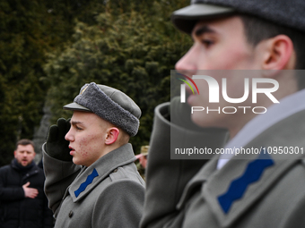 National Guard servicemen are saluting during a ceremony to commemorate the Kruty Heroes on the 106th anniversary of the Battle of Kruty, wh...