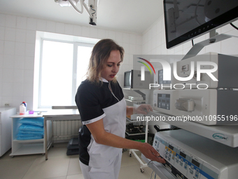 A nurse is working in the operating room of the maternity hospital that was repaired after Russian shelling in March 2022, in Kharkiv, Ukrai...