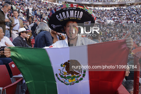 A person is wearing a sombrero and holding a Mexican flag inside the Plaza Mexico in Mexico City, as members of various animal rights, welfa...