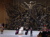 Pope Francis (C) is attending the weekly general audience at Paul-VI hall in the Vatican, on February 7, 2024. (