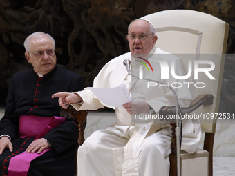 Pope Francis (R) is attending the weekly general audience at Paul-VI hall in the Vatican, on February 7, 2024. (