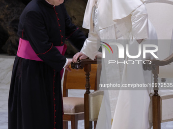 Pope Francis (R) is attending the weekly general audience at Paul-VI hall in the Vatican, on February 7, 2024. (