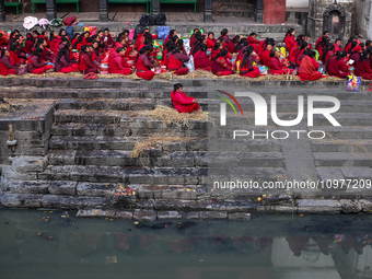 Nepali Hindu devotees are performing rituals on the embankment of the Bagmati River in Kathmandu, Nepal, on February 9, 2024, as part of the...