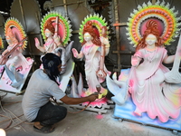 Bangladeshi Clay Artist Applies Paint To An Idol Of The Hindu Goddess Saraswati At A Temple In Dhaka, Bangladesh, on February 9, 2024. (