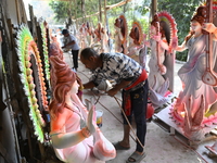 Bangladeshi Clay Artist Applies Paint To An Idol Of The Hindu Goddess Saraswati At A Temple In Dhaka, Bangladesh, on February 9, 2024. (
