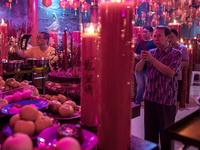 Indonesians of Chinese descent are offering prayers on the eve of the Lunar New Year at the Hok Lay Kiong Temple in Bekasi, Indonesia, on Fe...