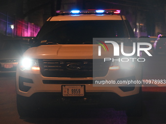 A police vehicle is at the crime scene where police are involved in a shooting in Washington, D.C., United States, on February 9, 2024. Offi...