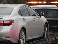 A vehicle containing a deceased victim is being towed away after a shooting in Temple Hills, Maryland, United States, on February 10, 2024....