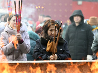 People are burning incense sticks at the temple in Shenyang, Liaoning Province, China, on February 10, 2024. (
