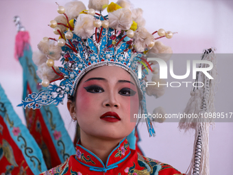 A Chinese artist is posing for photos during a cultural fair at Tundikhel in Kathmandu, Nepal, on February 12, 2024, to celebrate Chinese Ne...