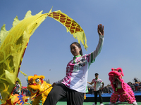 Chinese artists are performing a dragon dance to celebrate Chinese New Year at a cultural fair in Tundikhel, Kathmandu, on February 12, 2024...
