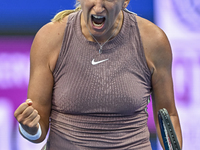 Victoria Azarenka from Belarus is reacting during her first-round match against Magdalena Frech of Poland at the WTA 1000-Qatar TotalEnergie...