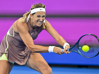 Victoria Azarenka from Belarus is playing in her first-round match against Magdalena Frech of Poland at the WTA 1000-Qatar TotalEnergies Ope...