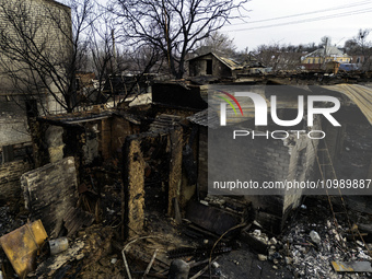 Houses and civilian cars are being destroyed in the fire following an attack by Russia's Shahed strike drones in Kharkiv, Ukraine, on Februa...