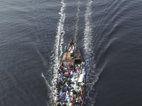 Muslim devotees are leaving on an overcrowded boat after taking part in Akheri Munajat, or final prayers of the second phase, at the Biswa I...