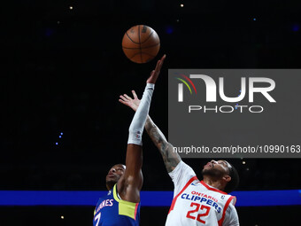 Iverson Molinar (7) of the Capitanes and Xavier Moon (22) of the Ontario Clippers are jumping for the rebound during the NBA G League match...