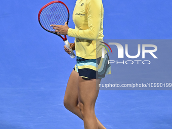 Caroline Garcia of France is reacting during her first-round match against Naomi Osaka of Japan at the WTA 1000-Qatar TotalEnergies Open ten...