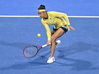 Caroline Garcia of France is in action during her first-round match against Naomi Osaka of Japan at the WTA 1000-Qatar TotalEnergies Open te...