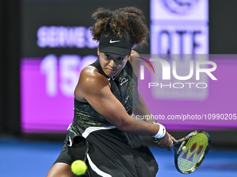Naomi Osaka of Japan is playing in her first-round match against Caroline Garcia of France at the WTA 1000-Qatar TotalEnergies Open tennis t...