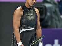 Naomi Osaka of Japan is reacting during her first-round match against Caroline Garcia of France at the WTA 1000-Qatar TotalEnergies Open ten...