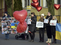 Heart-shaped red balloons are being displayed during a rally in Yevropeiska Square to remind people about the Mariupol Garrison POWs in Vinn...