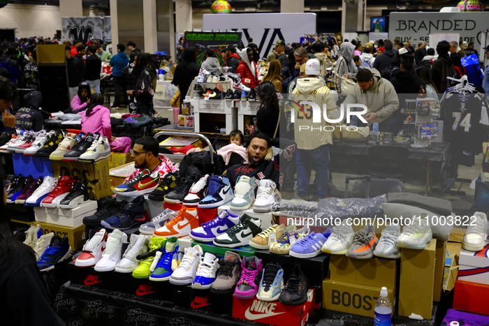 People are browsing the merchandise on display during the 15th SneakerCon at the Pennsylvania Convention Center in Philadelphia, PA, USA, on...