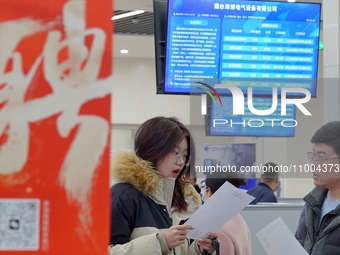 Job seekers are talking with employers at the 2024 job fair in Yantai, China, on February 18, 2024. In 2023, 12.44 million new urban jobs we...