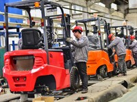 Workers are assembling at a workshop of a machinery and equipment manufacturing enterprise in Qingzhou, East China's Shandong province, on F...