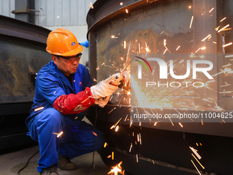 Workers are polishing at the production workshop of Nanjing Changjiang Industrial Furnace Technology Group Co., Ltd. in Nanjing, Jiangsu pro...