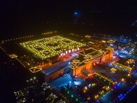 Tourists are visiting the Yellow River 9 lamp array, known as ''China's largest lantern array,'' in Zhangye, Gansu Province, China, on the e...