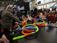 Children are playing with Hot Wheels cars at the Canadian International Auto Show in Toronto, Canada, on February 19, 2024. (