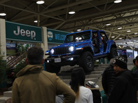 Visitors are experiencing a performance of Jeep off-road vehicles at the Canadian International Auto Show in Toronto, Canada, on February 19...