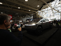 Visitors are taking photos and videos of the Tesla Cybertruck at the Canadian International Auto Show in Toronto, Canada, on February 19, 20...